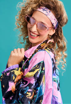 Inspired by the 80s. Studio shot of a beautiful young woman wearing a 80s outfit