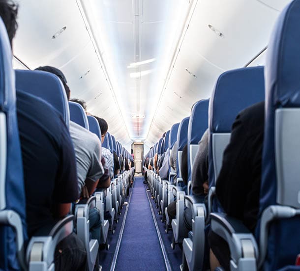 View of and aisle of a modern jetliner.