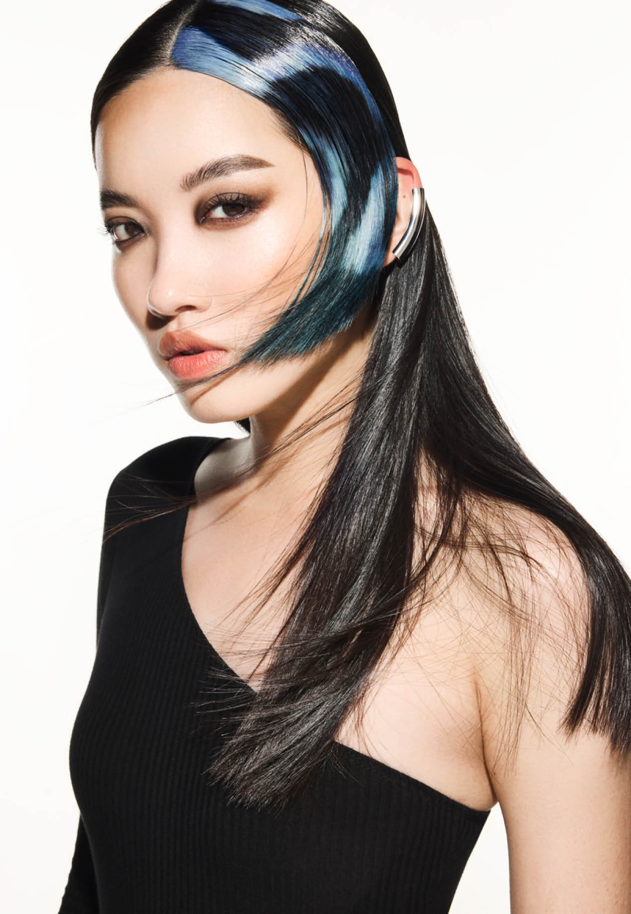 FY24 Education Trends Contract Collection Aveda x Luis Gonzalez Single Individual Adult Female Model Woman Artistry White Background Edgy Hair Color Cutting Styling A dynamic interplay of contrasting colors created captivating hair color narratives