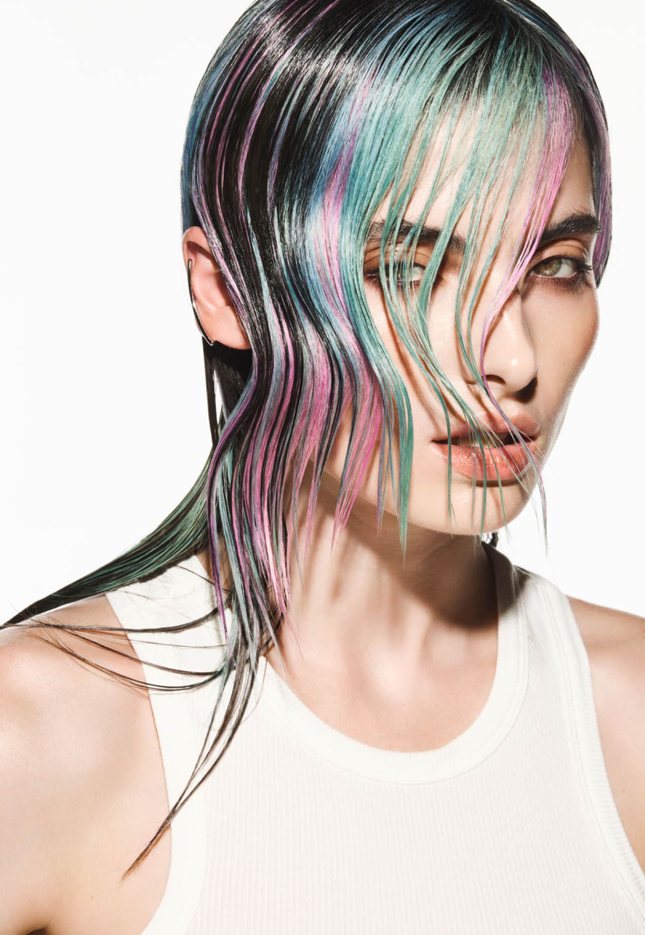 FY24 Education Trends Contract Collection Aveda x Luis Gonzalez Single Individual Adult Female Model Woman Artistry White Background Edgy Hair Color Cutting Styling A dynamic interplay of contrasting colors created captivating hair color narratives