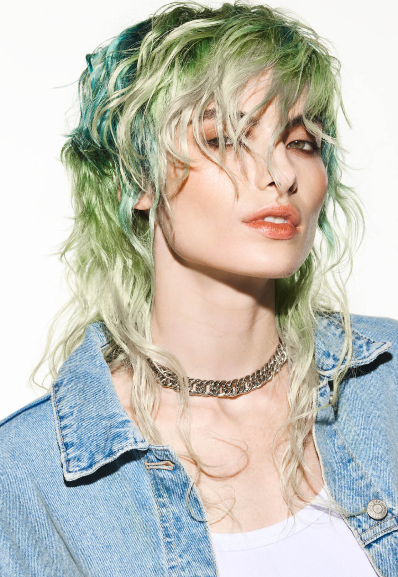 FY24 Education Trends Contract Collection Aveda x Luis Gonzalez Single Individual Adult Female Model Woman Artistry White Background Edgy Hair Color Cutting Styling A dynamic interplay of contrasting colors created captivating hair color narratives