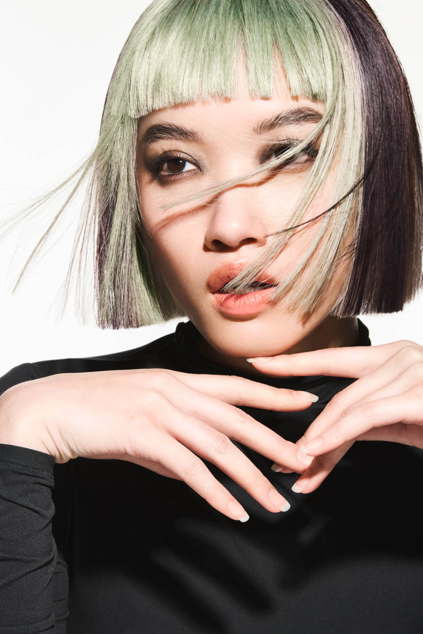 FY24 Education Trends Contract Collection Aveda x Luis Gonzalez Single Individual Adult Female Model Woman Artistry White Background Edgy Hair Color Cutting Styling A dynamic interplay of contrasting colors created captivating hair color narratives