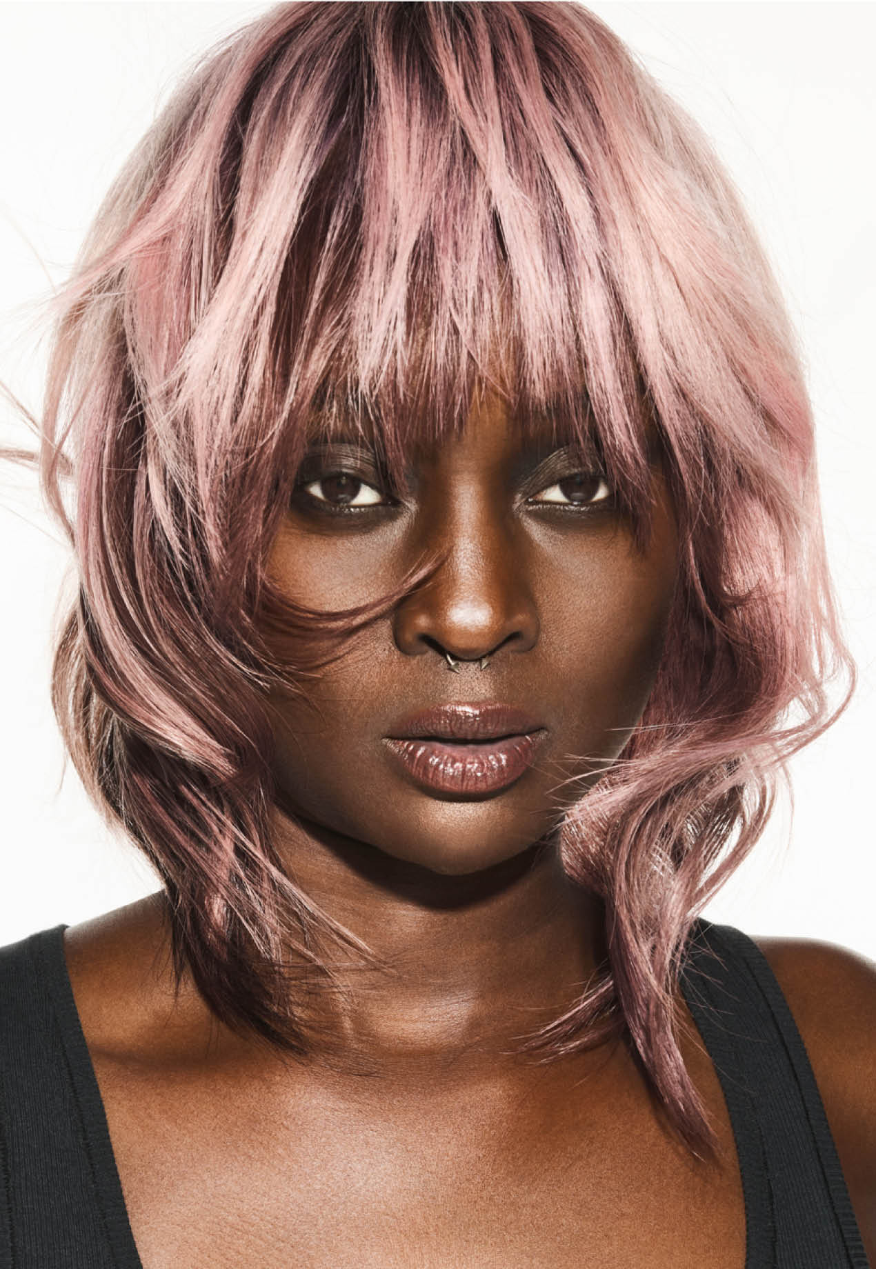 FY24 Education Trends Contract Collection Aveda x Luis Gonzalez Single Individual Adult Female Model Woman Artistry White Background Edgy Hair Color Cutting Styling A dynamic interplay of contrasting colors created captivating hair color narratives