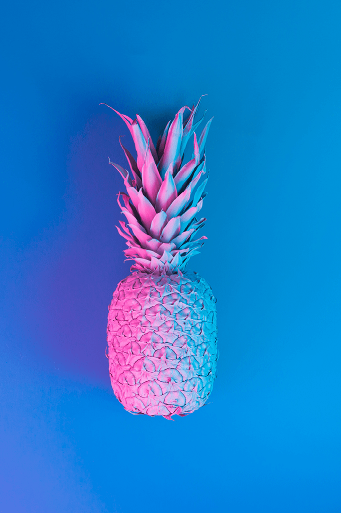 Pineapple in vibrant bold gradient holographic neon colors. Concept art. Minimal surrealism background.