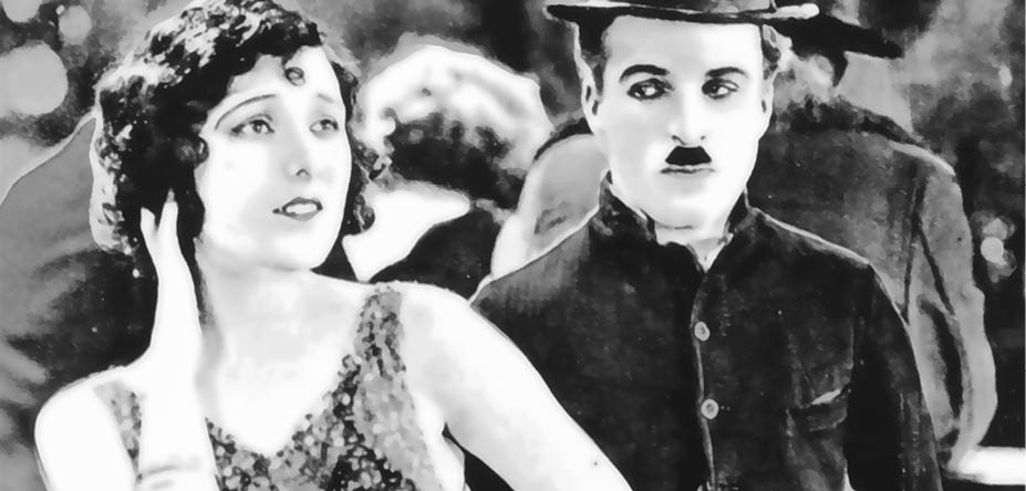 Viersen, Germany - June 9. 2024: Photo of Gold Rush film scene with with Charlie Chaplin and Georgia Hale from 1925 in old magazine (focus on center)