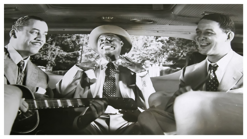 Viersen, Germany - January 1. 2023: Closeup of High Society movie film scene photography with Louis Armstrong and band singing in car from 1956 (focus on center)