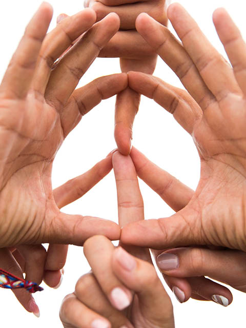 youth culture, gesture and people concept - close up of hippie friends showing peace hand sign outdoors